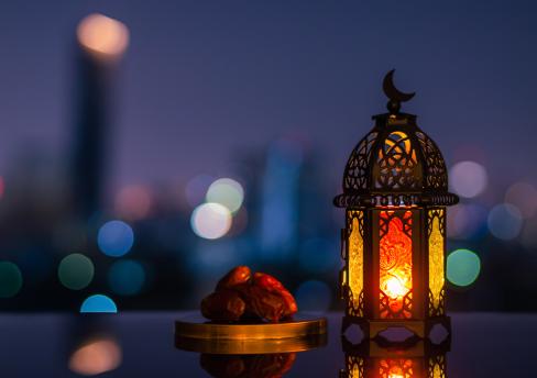 Ramadan and Eid. Lantern with crescent moon pictured 