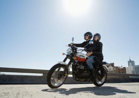 two people on a motorcycle. 